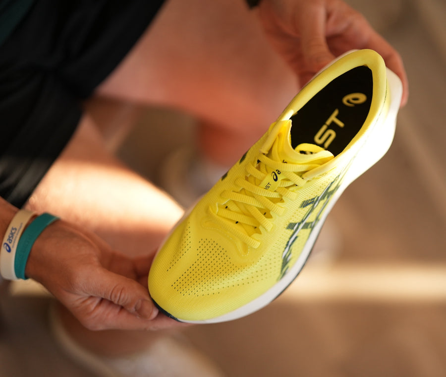 A fit specialist at the shoe wall